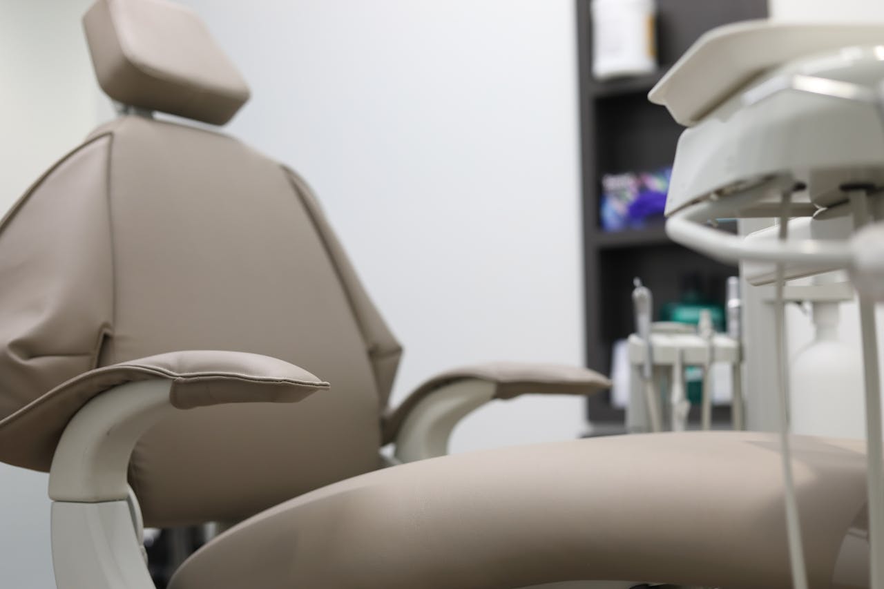 about-01 Close-up of dental chair and equipment in a clinical setting, emphasizing healthcare technology.